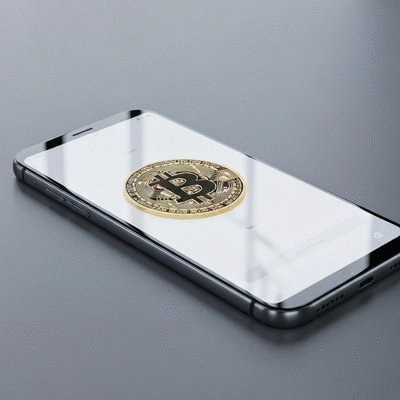 Person holding a physical Bitcoin coin with a secure digital wallet interface on a tablet in the background